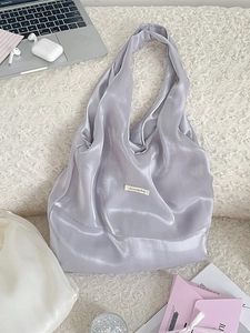 Elegant soft satin hobo shoulder bag in light lavender with a pleated texture and silky finish