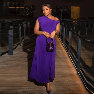 Elegant purple off-shoulder evening dress with ruched waist and silky draped long skirt