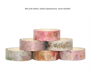 Stack of six assorted washi tape rolls featuring floral, geometric, and celestial patterns