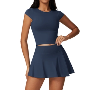 Navy blue two-piece yoga set with slim-fit short sleeve crop top and high waist sports skirt