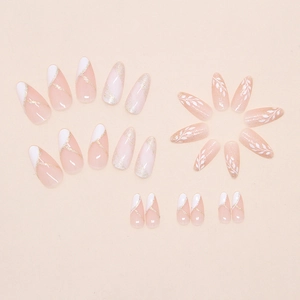 French tip almond press-on nails with fine glitter lines and hand-painted leaf designs