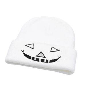 White Halloween knit beanie featuring black embroidered Jack Skellington smile face