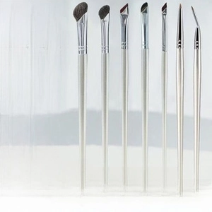 Detail of 7-piece mini makeup brushes with pony hair bristles and silver metal handles