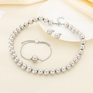 Polished stainless steel jewelry set featuring a beaded necklace, bracelet and stud earrings