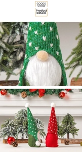 Close-up of knitted Christmas gnomes with long faux fur beards and festive accessories