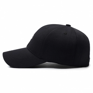 Classic black canvas baseball cap with embroidered smiley face in minimalist outdoor style