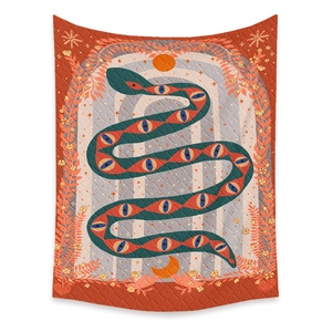 Macro detail of quilted bohemian tapestry with snake, sun, and celestial mystic patterns