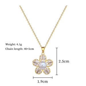 Detailed size view of a gold five-petal flower pendant necklace with white pearl