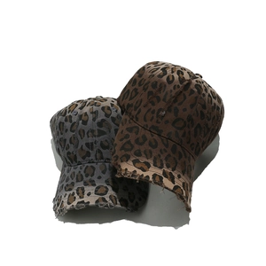 Distressed leopard print baseball caps in grey and brown washed canvas with torn edges
