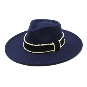 Detailed view of the dark blue wide-brim wool fedora hat with elegant beaded ribbon trim