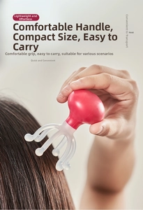 Manual head massager with red handle used for scalp massage to relieve stress and fatigue