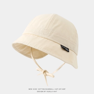 Detail of baby cotton sun hat featuring clean stitching and adjustable chin strap