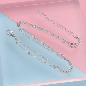 Double-layer stainless steel beaded chain bracelet with lobster clasp in silver finish