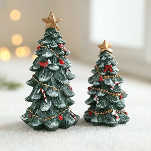 Mini resin green Christmas trees with red berries and golden stars for desk decor