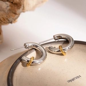 Minimalist silver and 18k gold plated stainless steel interlocking hoop earrings