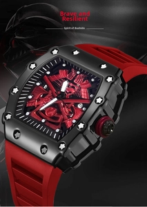Detail of red samurai relief dial and star screws on tonneau shaped sports watch