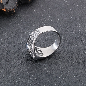 Close-up of vintage punk skull ring with detailed metallic texture and silver finish