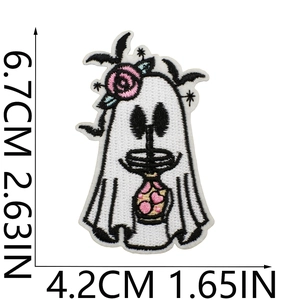 Close-up of ghost embroidery patch with pink flower and bat, measuring 6.7x4.2 cm