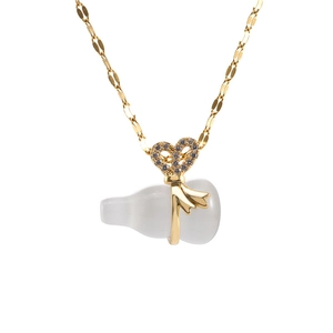 Gold-plated necklace with white opal gourd pendant and diamond-encrusted bow design