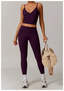Detail of dark purple ribbed yoga set with V-neck sports bra and high-waist leggings
