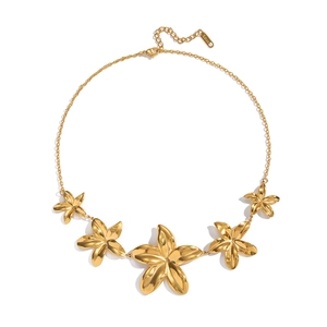 Elegant gold stainless steel necklace with five graduated floral pendants on white backdrop