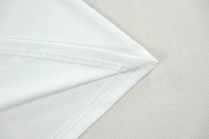 Detailed macro view of high-quality overlock stitching on white slim fit garment fabric