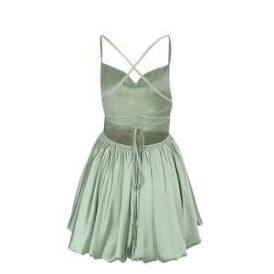 Back view of a sage green satin dress featuring a lace-up open back and a puff hemline