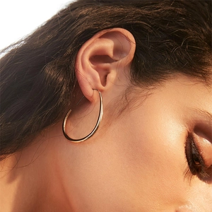 Polished 18k gold plated stainless steel tapered hoop earrings for women in minimalist style