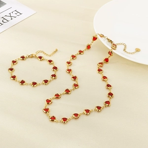 Gold stainless steel jewelry set with red glass heart charms necklace and bracelet
