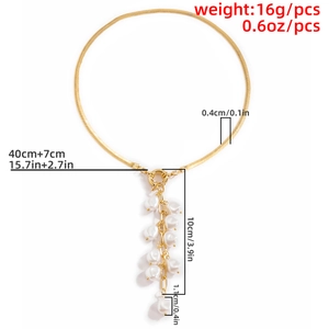 Detail view of 40cm golden snake chain necklace with 10cm pearl tassel and 7cm extender