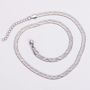 Detail of silver stainless steel snake chain with lobster clasp and extension link