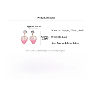 Close-up of strawberry drop earrings with pink resin body and sparkling zircon stud details