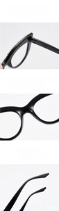 Detail of black cat-eye glasses with rhinestone inlay, fixed nose pads and ergonomic temples