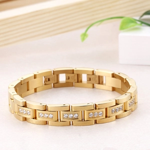 Detail of gold link bracelet featuring three rows of clear cubic zirconia stones