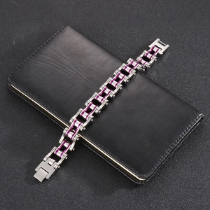 Men's stainless steel bicycle chain bracelet with purple accents on a black background