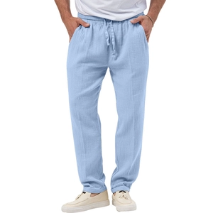 Detail of men's light blue casual trousers with elastic drawstring waist and textured fabric