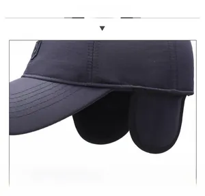Close-up of winter baseball cap featuring thick foldable ear flaps and windproof fabric