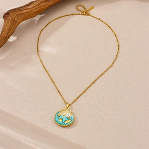 Golden stainless steel necklace featuring a gradient blue shell pendant with pearl accent