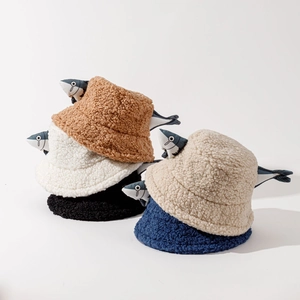 Close-up of fluffy lamb wool bucket hats with creative 3D cartoon fish design in five colors