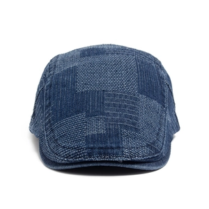 Adjustable washed blue denim newsboy cap with vintage patchwork textured design