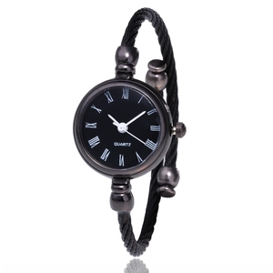 Elegant women's black quartz bangle watch with twisted mesh strap and Roman numerals