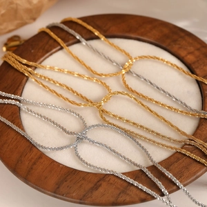 Three-layer cauliflower gold and silver stainless steel chain bracelets on fabric