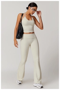 Chic cream halter neck workout set with high-waist flared yoga pants for fitness