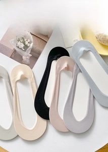 Flat lay of colorful ultra-thin ice silk invisible socks for women in soft summer colors