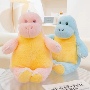 Detail of plush dinosaur toys with soft fur and embroidered eyes on a modern table