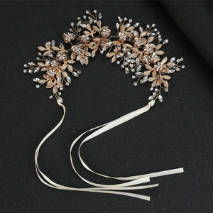 Exquisite bridal white leaf headband with golden petals and sparkling crystals on black background