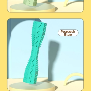 Detailed view of peacock blue dog chew toy with textured surface for dental cleaning