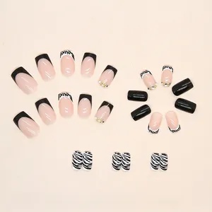 Long square press-on nails set with black white zebra print and rhinestone accents
