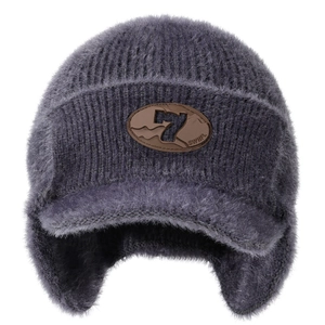 Detail of grey winter knit beanie featuring a brown leather patch and plush thermal lining