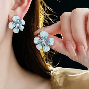 Elegant light blue crystal flower earrings with silver needle and sparkling rhinestones